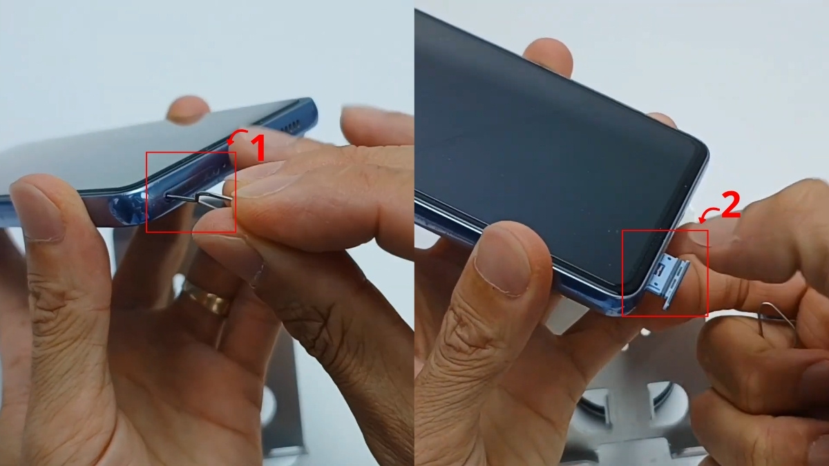 Dùng que chọc SIM tháo khay để sửa lỗi điện thoại không nhận thẻ nhớ.