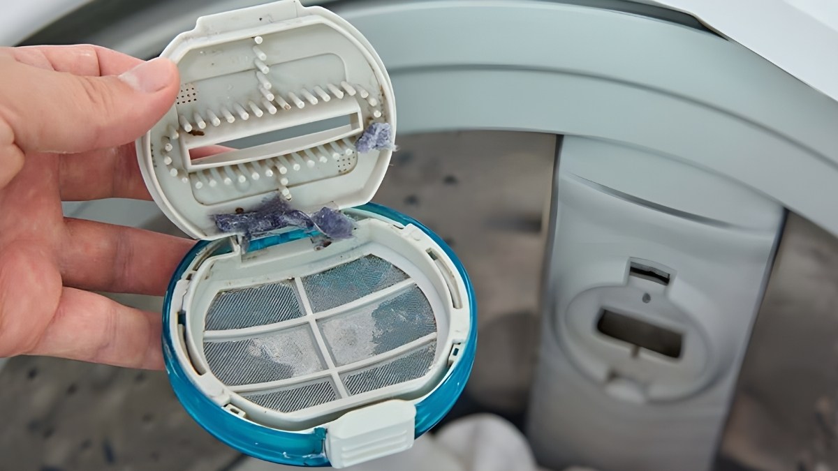 Bộ lọc cặn máy giặt cửa trên là gì?